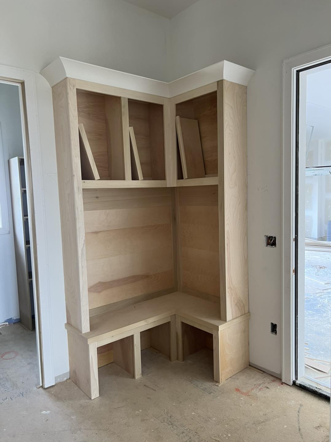 Custom mudroom built-in bench and cubby storage unit by Ruach Custom Carpentry in Columbus, Ohio, featuring handcrafted wood construction with upper storage cubbies, a seating bench, and lower cubby spaces designed for shoes and accessories. This custom carpentry project highlights expert finish carpentry, functional built-in design, and precision craftsmanship to maximize organization and style in a Central Ohio home.