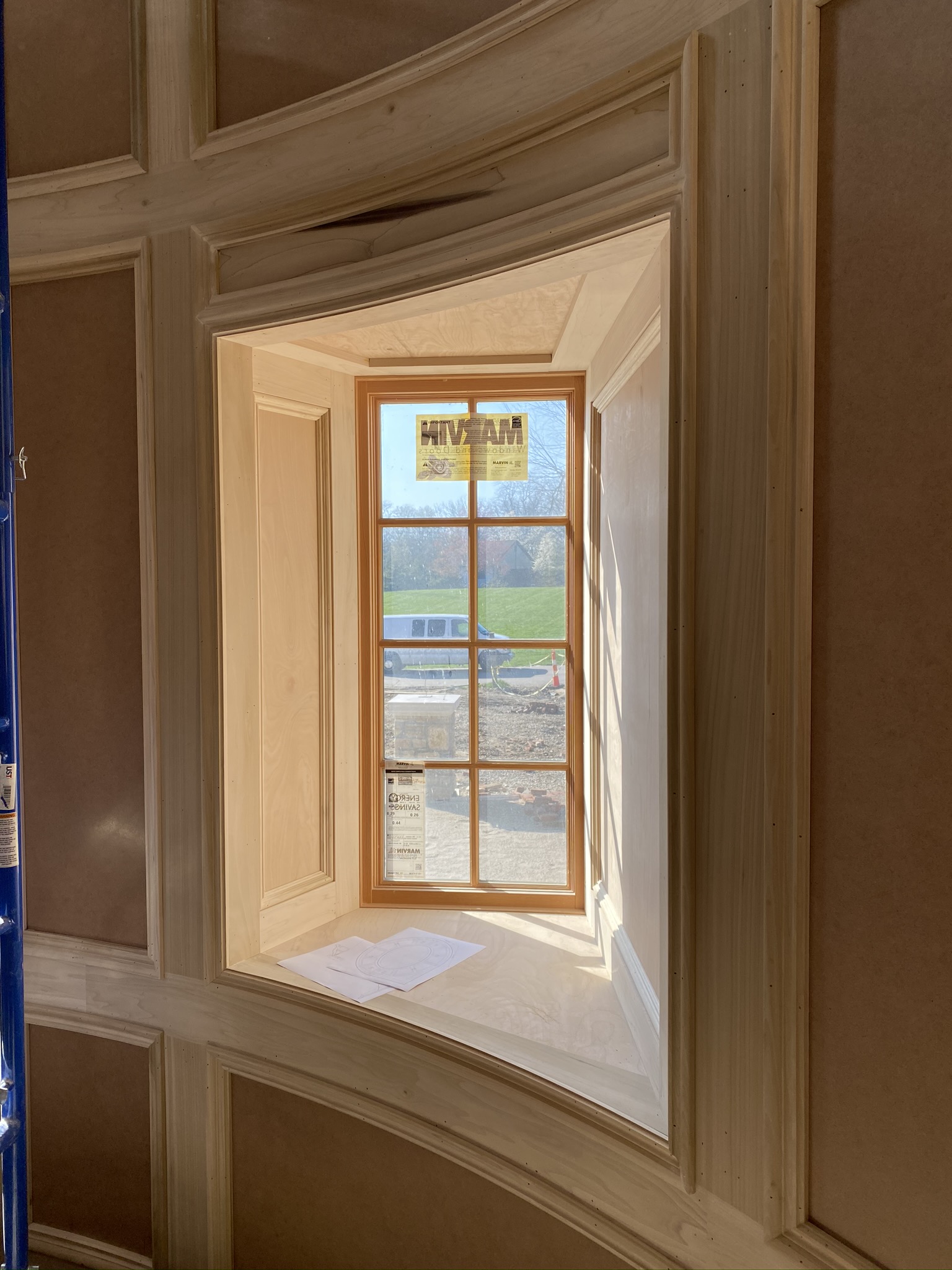 Custom curved wainscoting and detailed window trim installation by Ruach Custom Carpentry in Columbus, Ohio, featuring handcrafted curved wall paneling, precision trim work, and custom woodwork framing a deep-set window alcove. This luxury carpentry project showcases expert finish carpentry, curved architectural detailing, and high-end craftsmanship designed to elevate the elegance and character of a Central Ohio home.